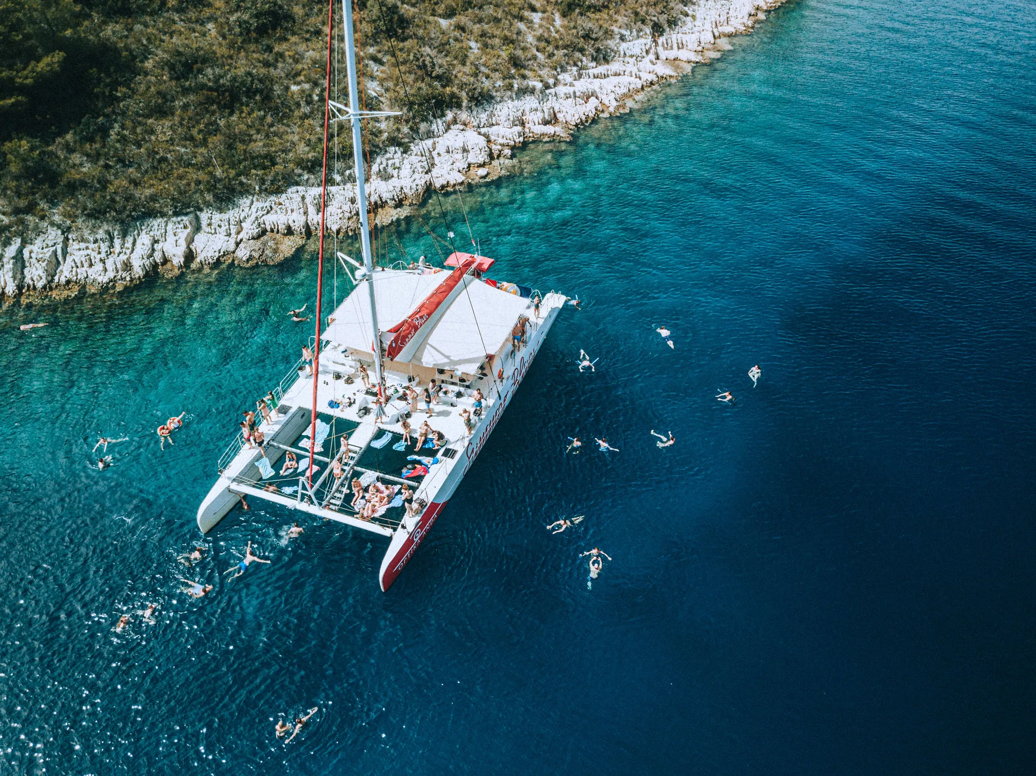 Summer Blues — Catamaran Social Media Photoshoot — aerial anchored